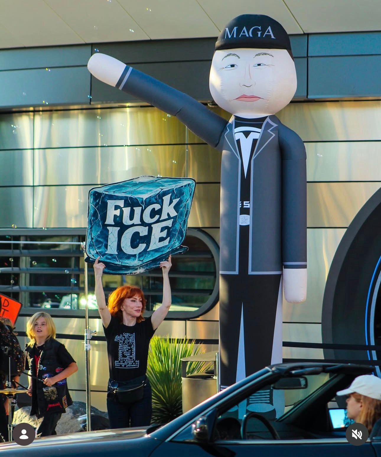 Large-format ICE protest sign with bold graphic design